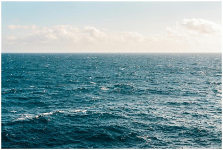 Tranquil ocean view under a clear sky, capturing t