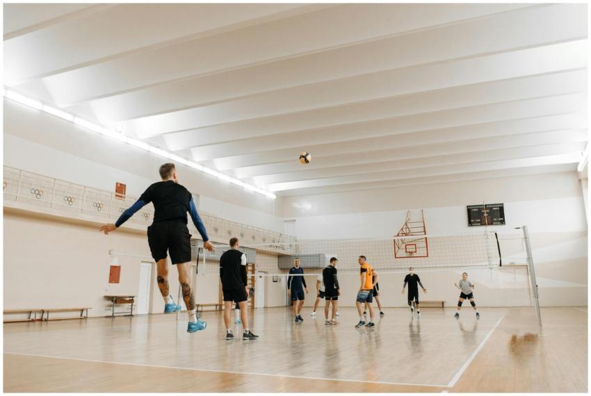 A dynamic indoor volleyball match featuring six at