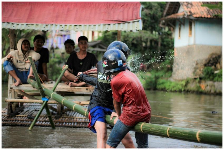 Traditional game on bamboo raft in Tasikmalaya, In