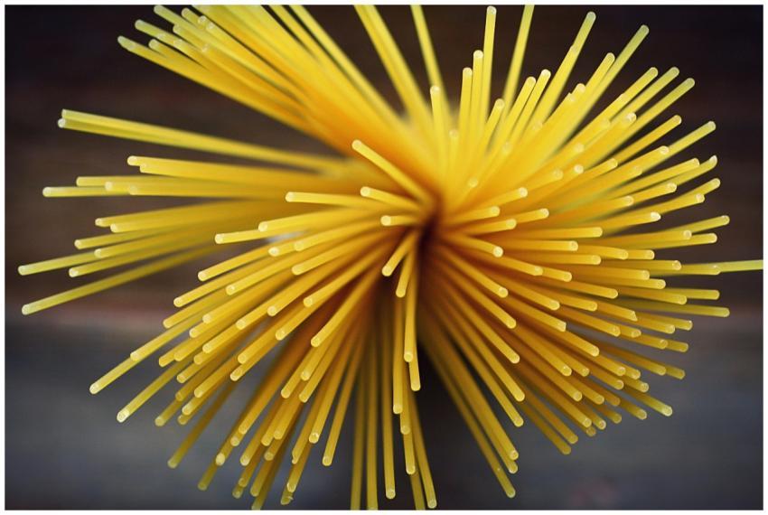 Close-up shot of uncooked spaghetti viewed from ab