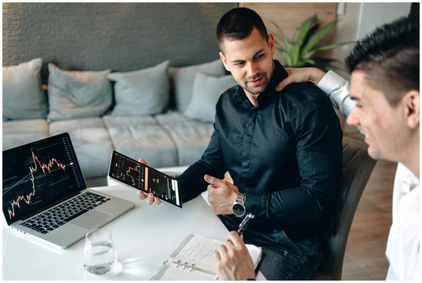 Two professionals engage in a strategy meeting usi