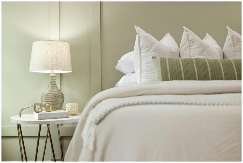 Elegant bedroom scene featuring a modern lamp, plu