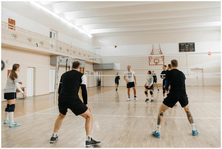 Energetic volleyball match with mixed team players