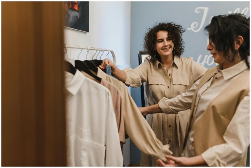 Two women enjoying a shopping experience in a mode