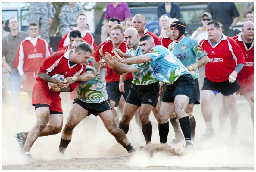 A competitive rugby match showcasing teamwork, ath