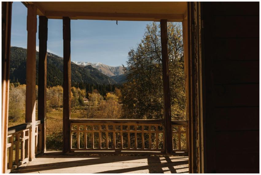 Serene autumn view of mountains from a rustic wood