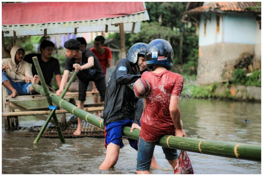 A group of people enjoying a playful water activit