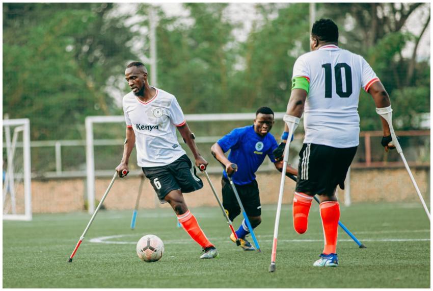Amputee football players in action during a compet