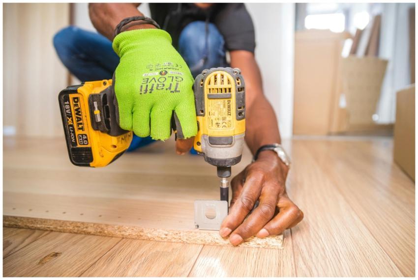 Man using a power drill for home improvement on a