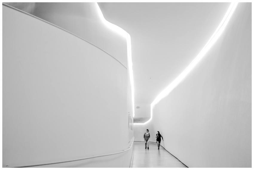 Futuristic indoor hallway in black and white with