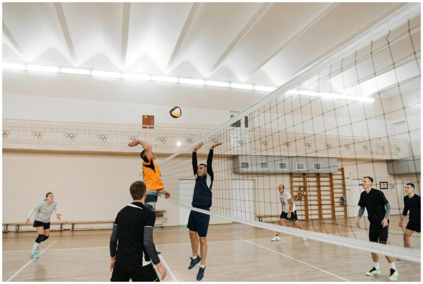 Dynamic scene of a competitive indoor volleyball g