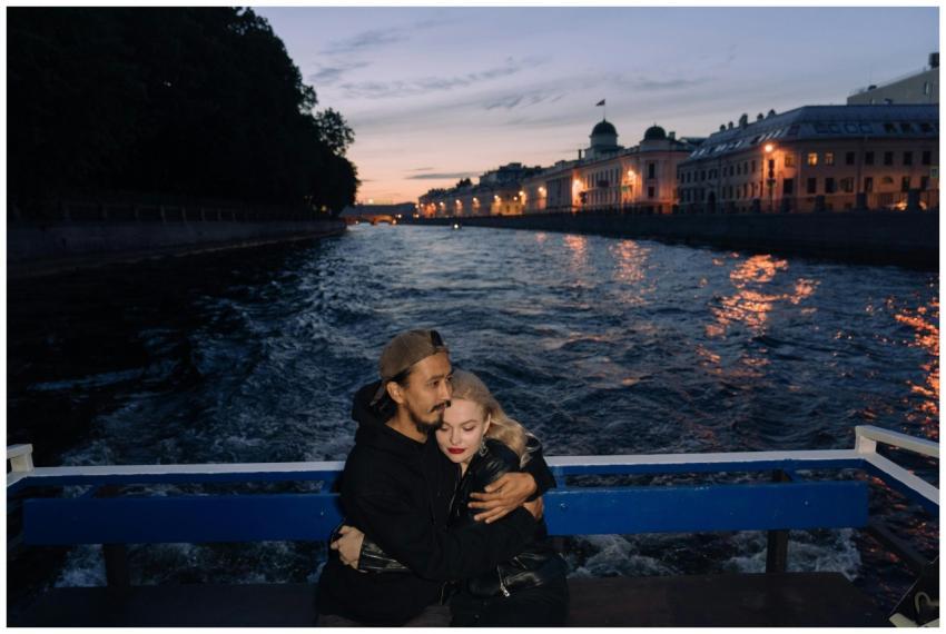 Couple enjoying a romantic boat ride on a river du