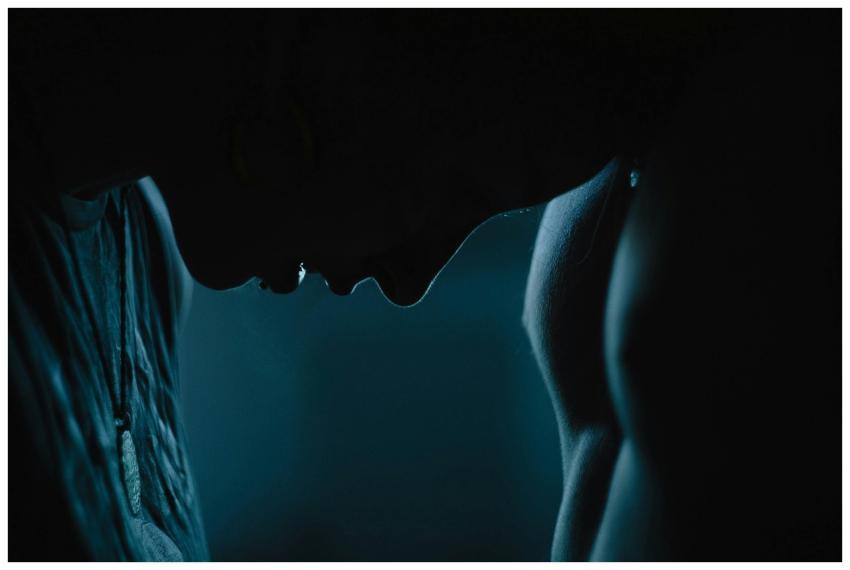 Silhouette of a couple facing each other, evoking