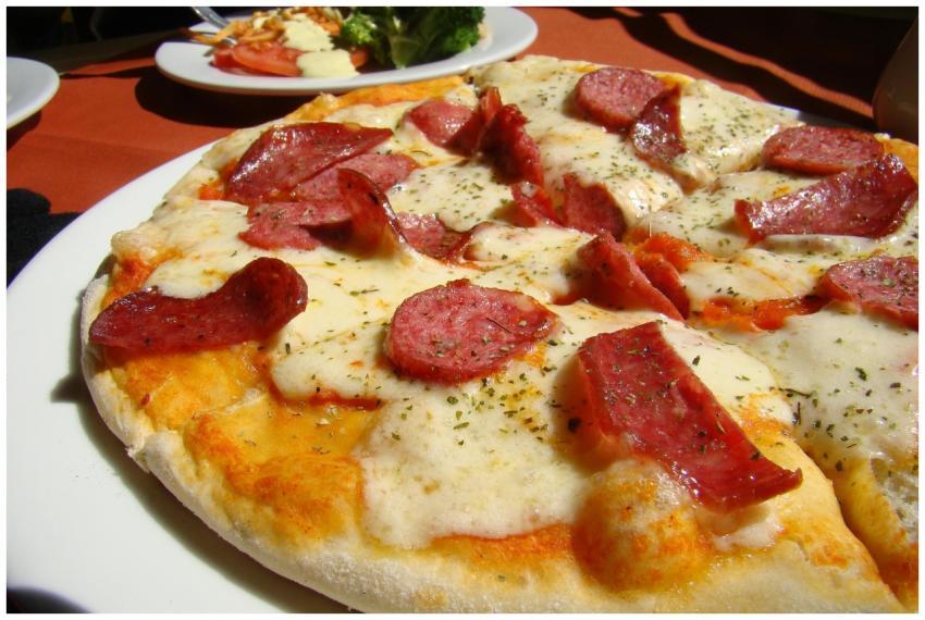 Close-up of a tasty pepperoni pizza with mozzarell