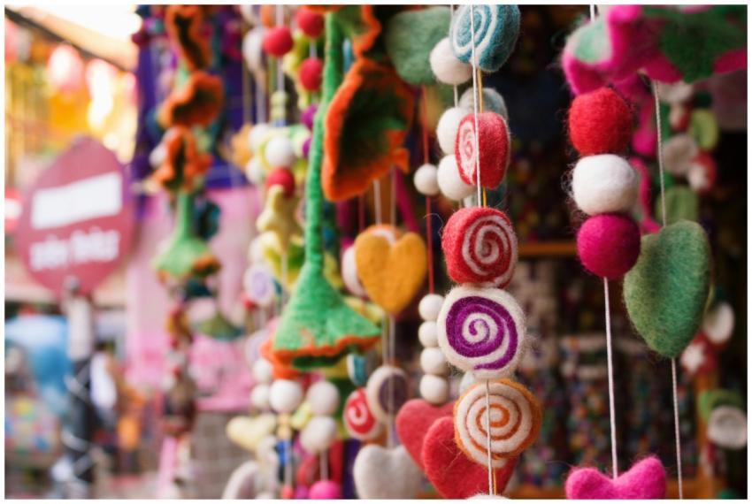 Vibrant hanging decorations made of threads in a N