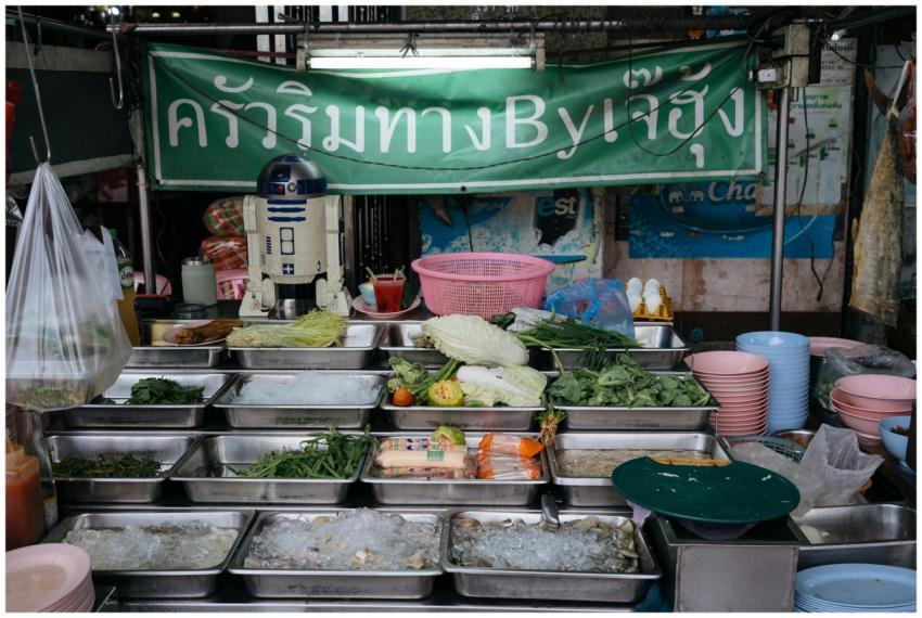 Colorful array of fresh ingredients at a Thai stre