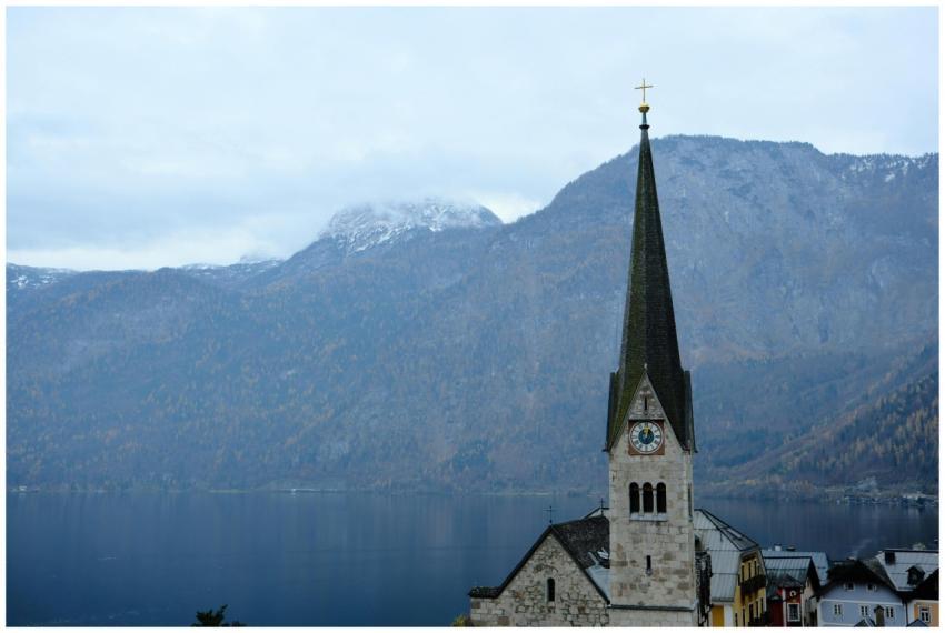 Picturesque church in Hallstatt with serene lake a