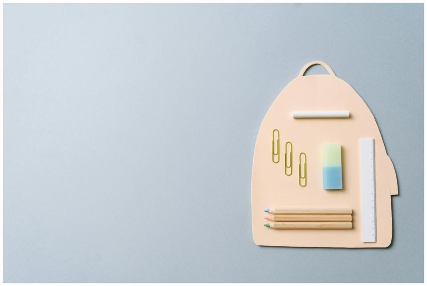 Minimalist top view of school supplies creatively