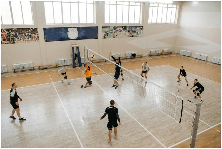 High-energy indoor volleyball game with teams comp
