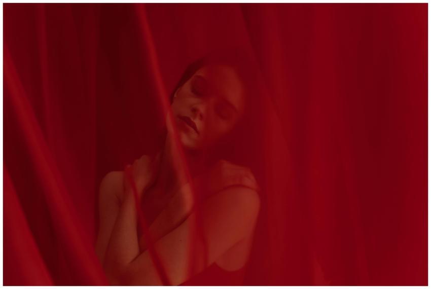 Artistic portrait of a woman with eyes closed surr