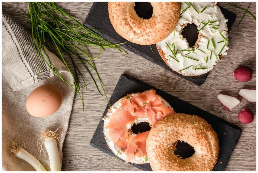 Tasty bagel breakfast with salmon, chives, and cre