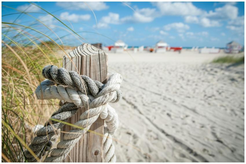 A detail shot of a rope tied around a wood post on