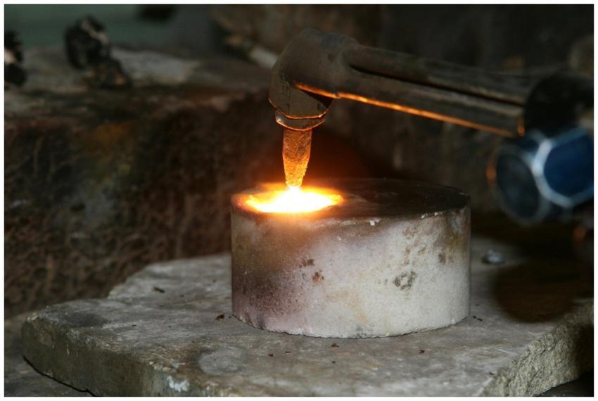 A close-up view of a metal smelting process using