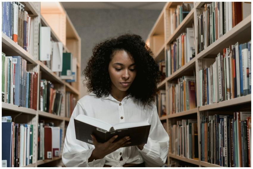 African American woman with curly hair standing in