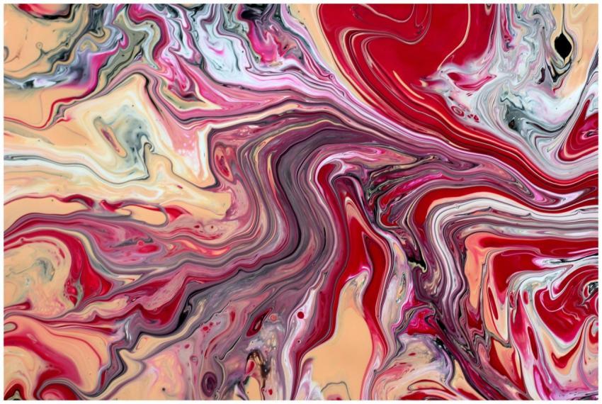 Dynamic swirl of red, beige, and pink hues in an a