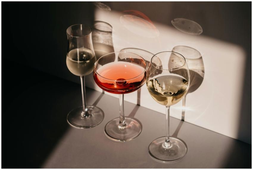 Elegant arrangement of three wine glasses casting
