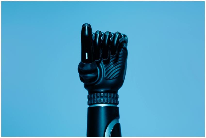 Close-up of a prosthetic arm in a vibrant blue set