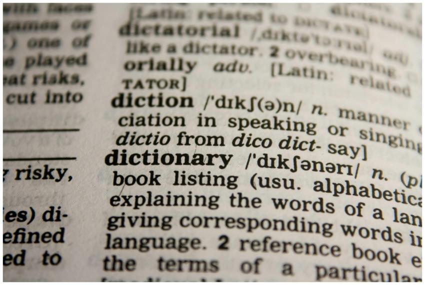 Detailed close-up view of a dictionary page highli