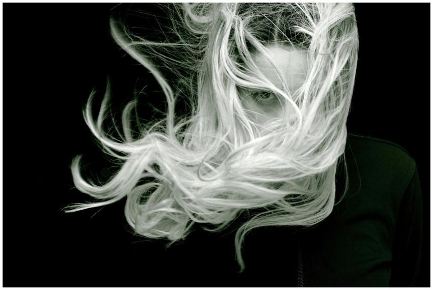 A striking black and white portrait of a woman wit