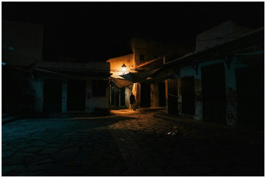 Eerie nighttime alley scene in Tangier's old town,