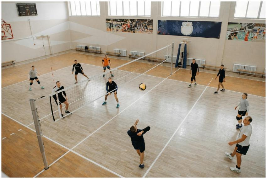 A dynamic volleyball game with athletes actively e