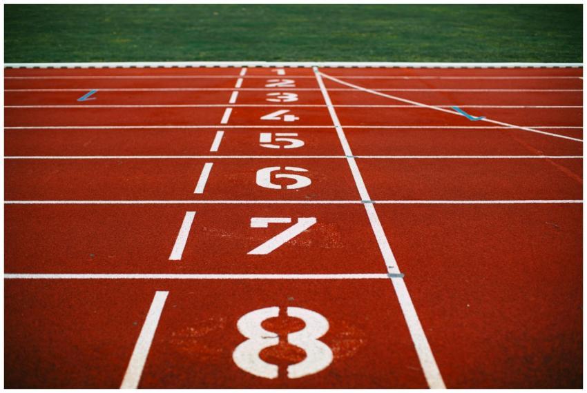 Close-up view of an athletic race track with numbe