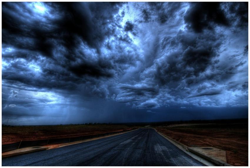 A dramatic stormy sky with dark clouds over an emp