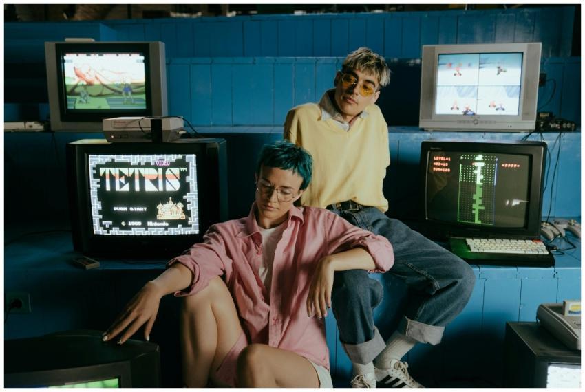 Teenagers enjoying retro video games in a vintage