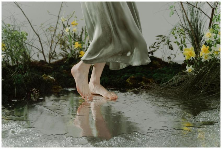 A serene moment capturing bare feet dancing on a r