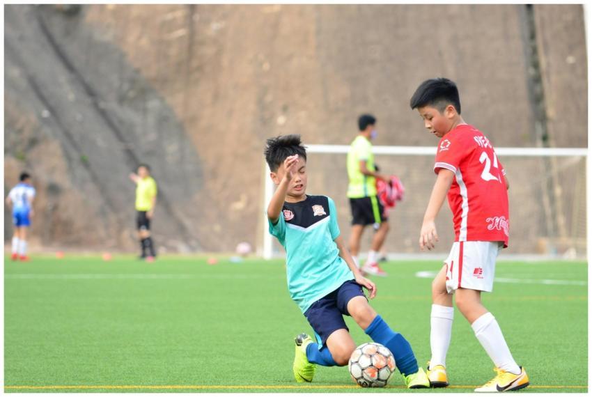 Children enjoying a lively soccer game outdoors, s