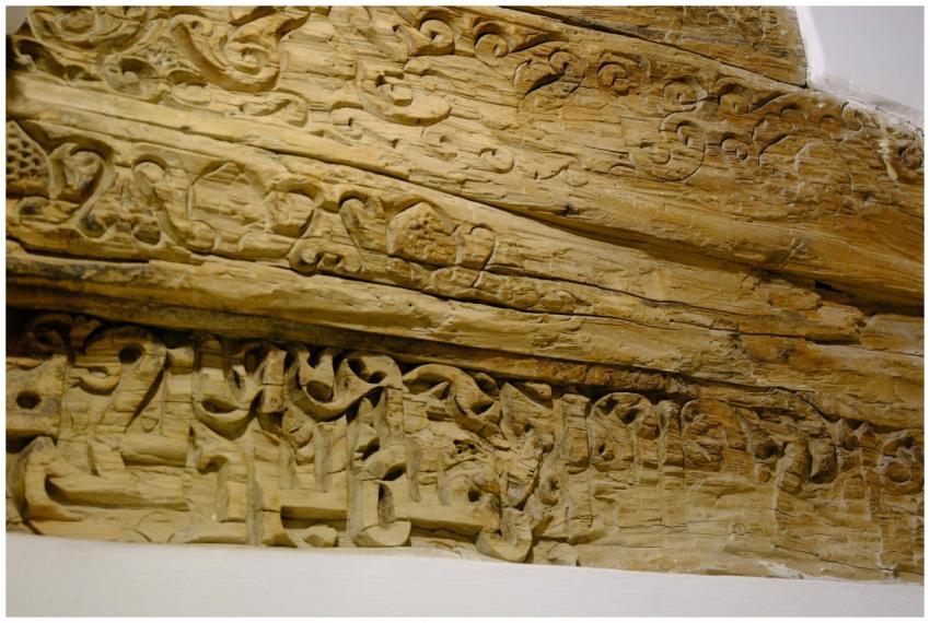 Intricate wood carving detail captured indoors in