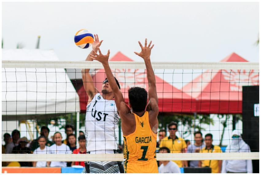 Beach volleyball action shot of two players compet