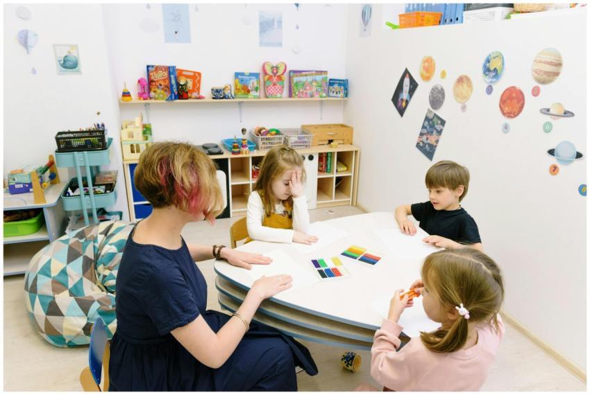 Children engage in a colorful activity with a teac