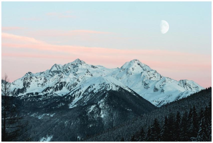 Majestic snow-covered mountain range with a rising