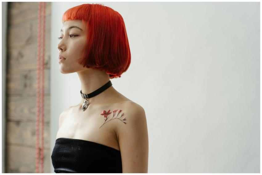 Portrait of a fashionable woman with red hair and