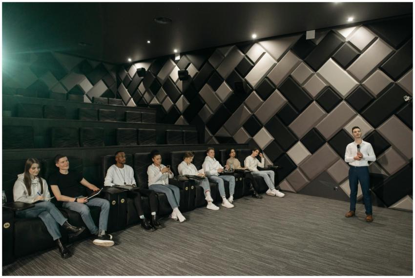 Speaker addressing a diverse audience in a modern