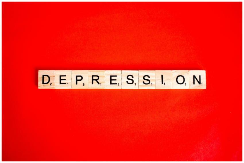 Word depression spelled with letter tiles on vibra