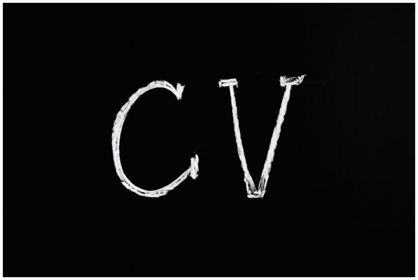 Chalk text 'CV' on a black chalkboard. Ideal for r