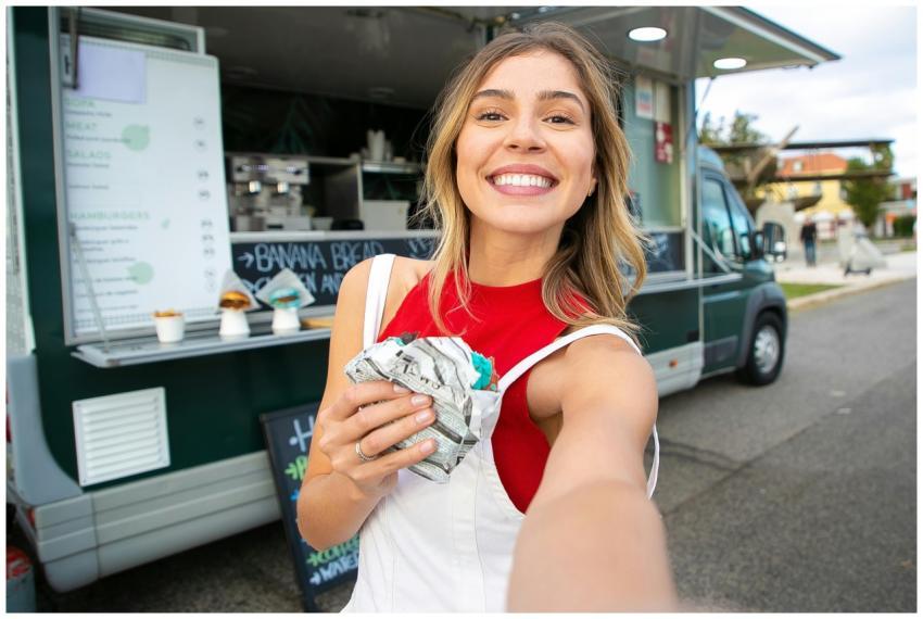 Happy woman in casual wear taking a selfie with st