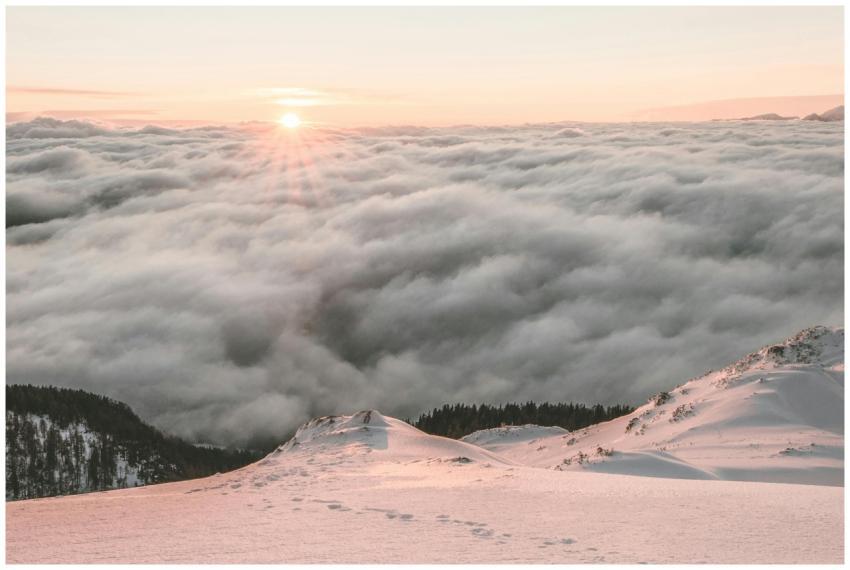 Breathtaking view of sunrise over a snow-covered m
